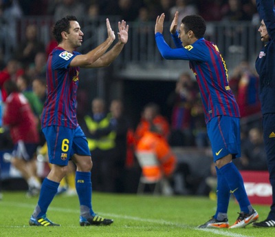 Xavi y Thiago, en un partido de Liga.