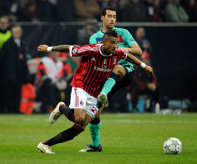 Busquets, junto a Boateng en el partido del miércoles contra el Milan.