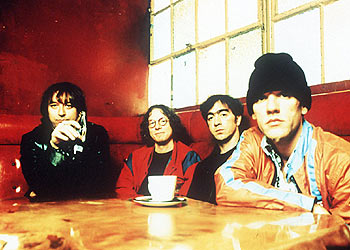 De izquierda a derecha, Peter Lawrence Buck, Michael Edward Mills, William Thomas Berry y John Michael Stipe.