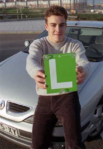 Con la  L,  tras aprobar el examen de conducir.