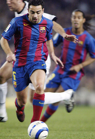 Xavi, en un encuentro contra el Valencia.