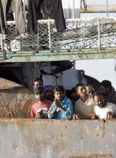 Inmigrantes a bordo del  Marine I  la víspera del desembarco.