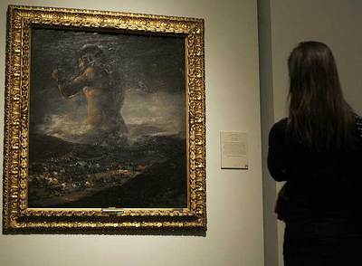  El coloso,   fotografiado ayer en El Prado; todavía se atribuía a Goya, como puede verse abajo. 