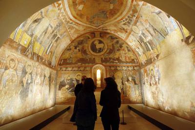Pinturas murales del siglo XII de la iglesia de la Vera Cruz de Maderuelo (Segovia), situadas en una de las nuevas salas del Museo del Prado inauguradas ayer.