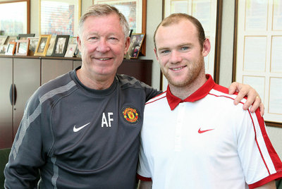 Ferguson y Rooney, sonrientes ayer tras la renovación del delantero.