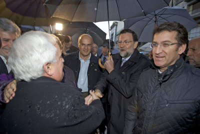 Mariano Rajoy y Alberto Núñez Feijóo saludan a José Luis Baltar en Ourense.